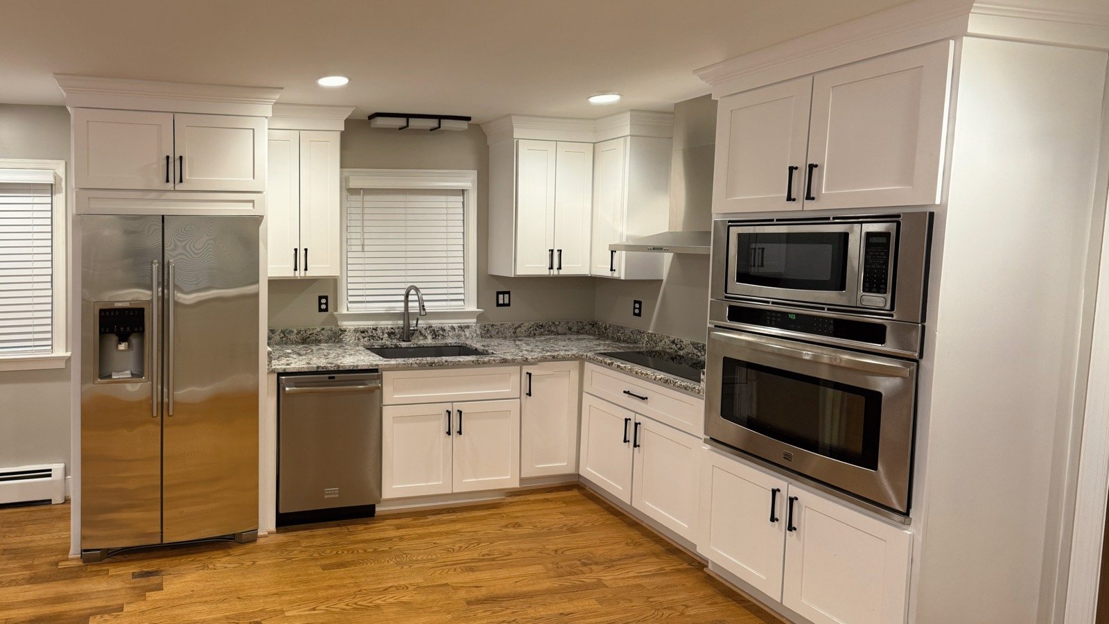 Custom Burlew kitchen cabinetry with a large island and natural wood finishes.
